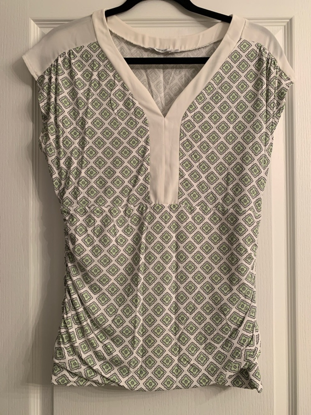 Ricki's White V-Neck Top with Green Geometric Print